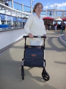 Woman enjoys traveling with a mobiity aid