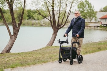 Man walking with a rollator for fall prevention